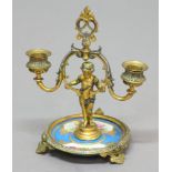 FRENCH GILT AND SILVERED METAL CANDELABRUM, late 19th century, a classical putto holding a two light