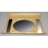 NEO-CLASSICAL OVERMANTEL MIRROR, 19th century, the oval plate flanked by a pair of slender