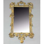 GEORGE III GILTWOOD WALL MIRROR, the bevelled rectangular plate inside a pierced and scrolling