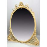 VICTORIAN OVERMANTEL MIRROR, the oval giltwood frame with gesso decoration of foliate scrolls and