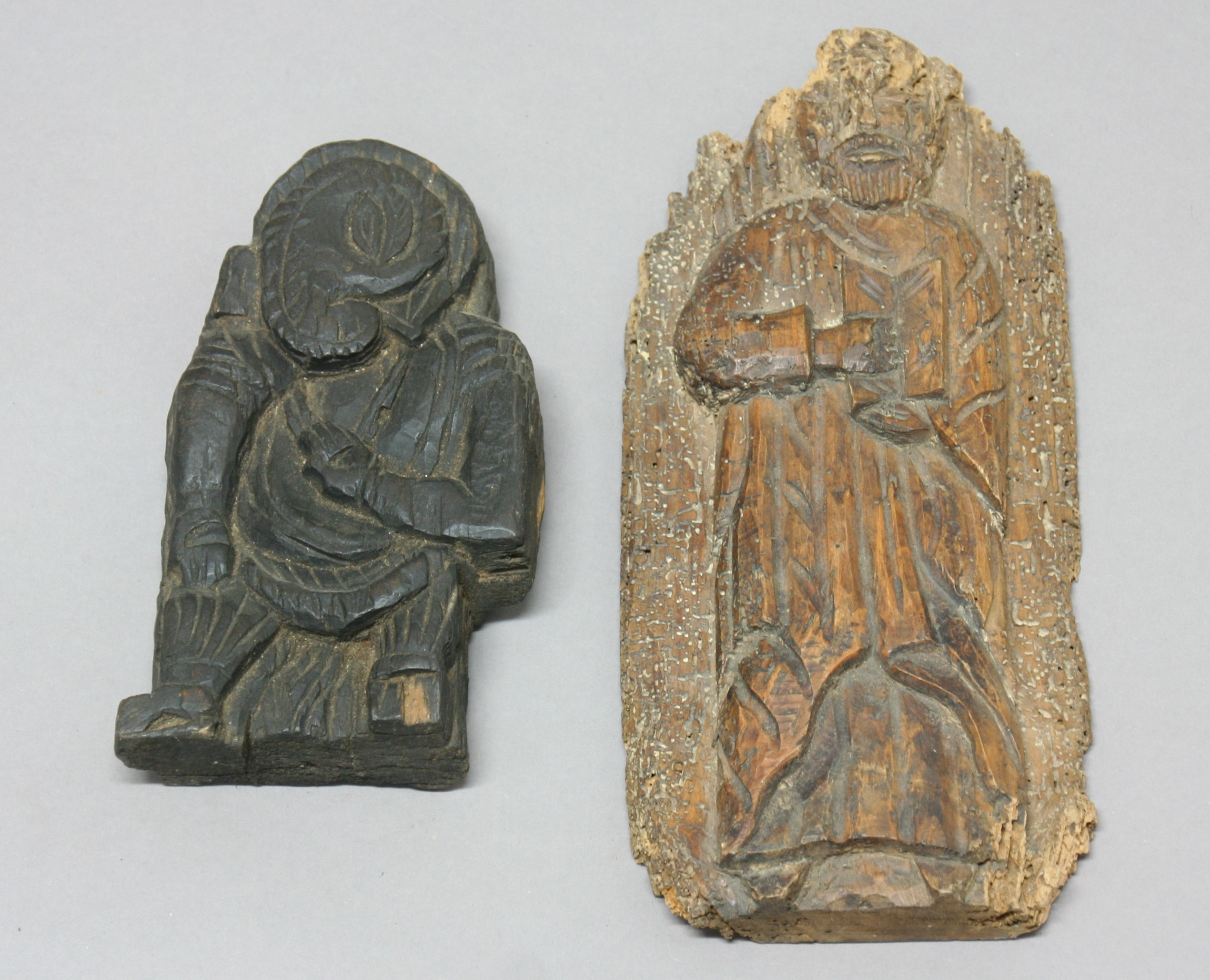 EARLY OAK CARVING OF A SAINT, possibly 17th century, height 27cm; together with another carving,