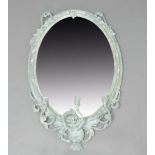 GEORGE III GESSO WALL MIRROR, the oval plate above three scrolling candle holders, the frame with
