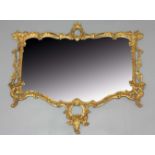 GEORGE III STYLE GILTWOOD WALL MIRROR, the cartouche shaped plate inside a pierced and scrolling