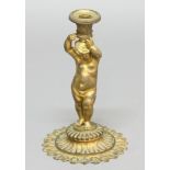 FRENCH GILT ORMOLU CANDLESTICK, 19th century, modelled as a putto holding a basket scone on his