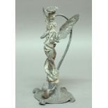 ART NOUVEAU CENTREPIECE, modelled as a male angel playing a lyre with scrolling supports behind, a