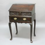 OAK BIBLE BOX ON STAND, 18th century, with fitted interior, the front panel initialled TB, the