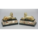 PAIR OF BRASS SPHYNX, recumbent, mounted on marble bases, height 23cm, length 29cm (2)