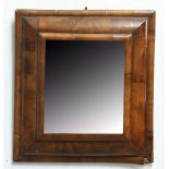 QUEEN ANNE STYLE WALNUT CUSHION MIRROR, the rectangular bevelled glass inside a moulded frame,