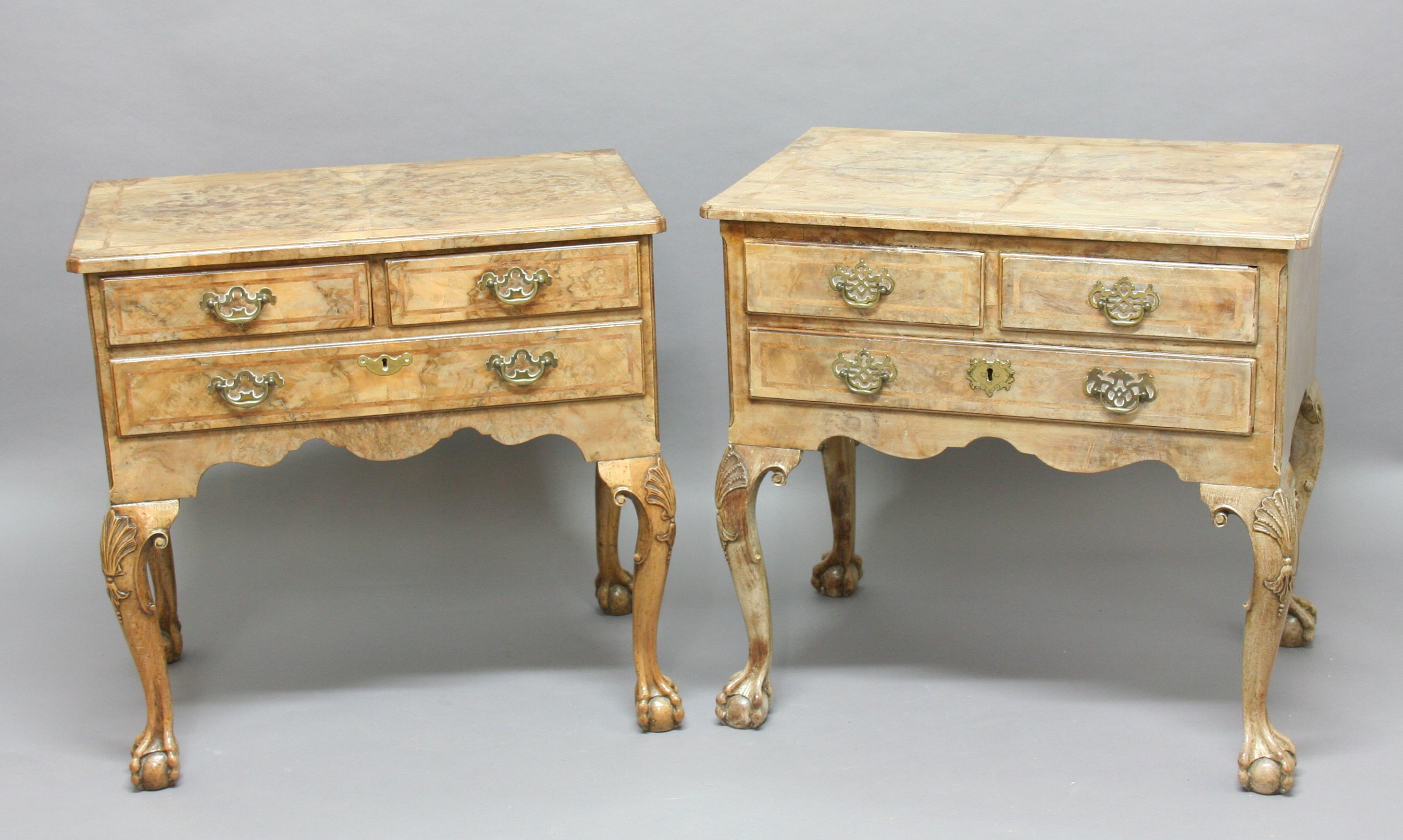 PAIR OF GEORGE II STYLE WALNUT LOW BOYS, two short and a long drawer with feather banding on