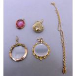 TWO VICTORIAN GOLD PICTURE LOCKETS AND TWO OTHER PENDANTS AND A CHAIN.