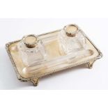 A LATE VICTORIAN INKSTAND with two mounted, cut-glass bottles, bracket feet, gadrooned borders and