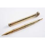 A LATE 19TH CENTURY GOLD-CASED COMBINED PENCIL & DIP-PEN in the form of a reeded column with a