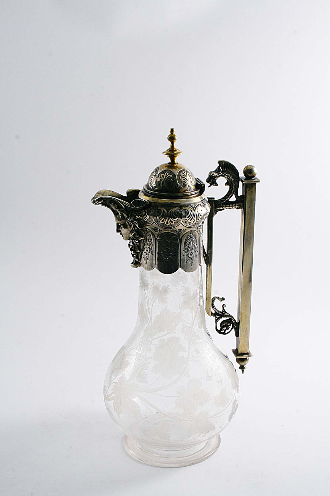 A VICTORIAN PLATED-MOUNTED CLEAR GLASS CLARET JUG with a baluster body, cut with a design of