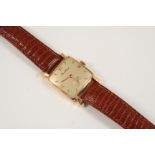 AN 18CT. GOLD MECHANICAL WRISTWATCH BY BREITLING the signed cushion-shaped dial with Roman and