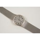 A 14CT. WHITE GOLD WRISTWATCH the circular grey granulated dial with Roman numerals, 34mm. dia.,