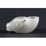 CHINESE WHITE JADE CARVING, in the form of a cow's head before a bowl, length 5.5cm