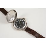A SILVER WRISTWATCH the silver full hunting cased watch with black enamel dial with white Arabic