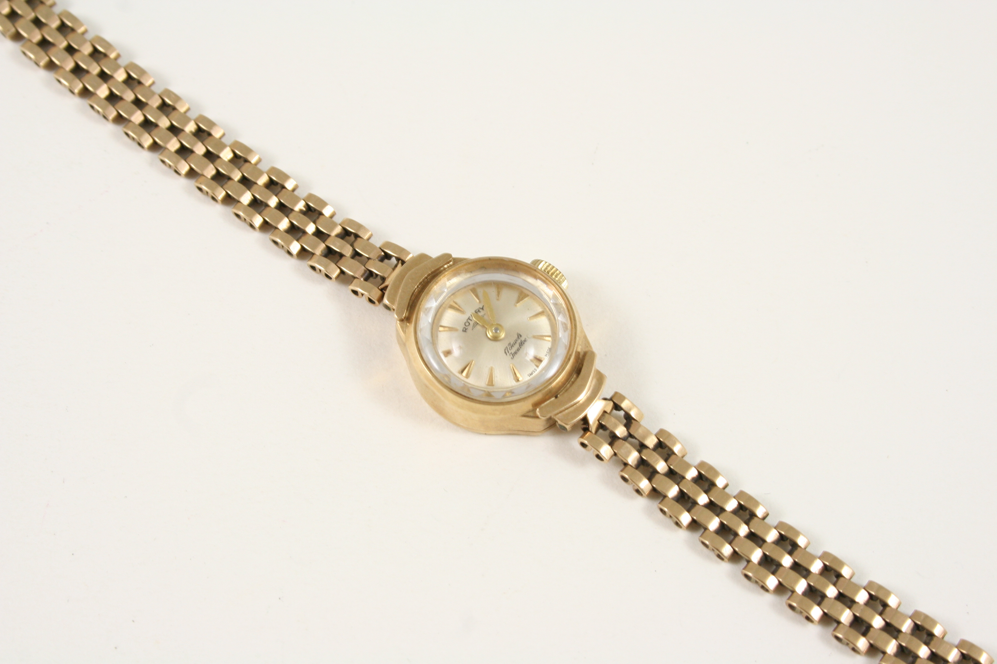 A LADY'S 9CT. GOLD WRISTWATCH BY ROTARY the signed circular dial with dagger numerals, on a gold