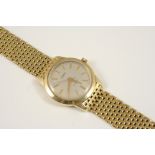 A GENTLEMAN'S 18CT. GOLD WRISTWATCH BY DOXA the signed circular dial with baton numerals and sweep