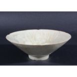 CHINESE QINGBAI STYLE BOWL, of foliate form with a narrow foot, with combed decoration beneath a