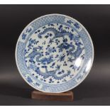 CHINESE BLUE AND WHITE CHARGER, 18th century, painted with two scrolling four claw dragons inside