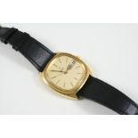 A GENTLEMAN'S GOLD PLATED WRISTWATCH BY OMEGA the signed cushion-shaped dial with baton numerals and
