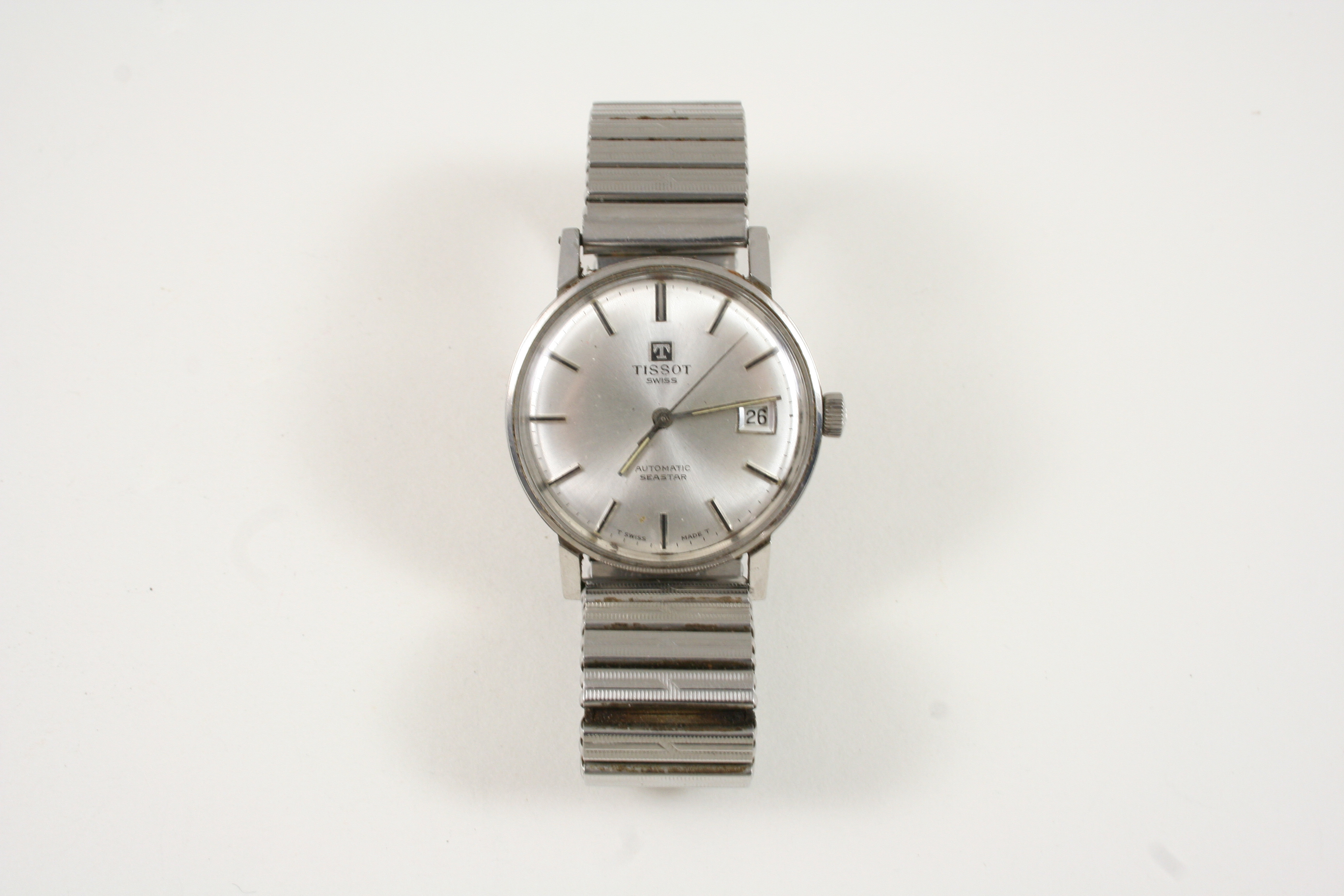 A GENTLEMAN'S STAINLESS STEEL AUTOMATIC SEASTAR WRISTWATCH BY TISSOT the signed circular dial with