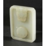 CHINESE WHITE JADE BELT BUCKLE, of rectangular form carved with a dragon head to one side and a