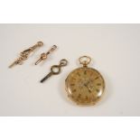 AN 18CT. GOLD OPEN FACED POCKET WATCH the gold foliate engraved dial with Roman numerals, with