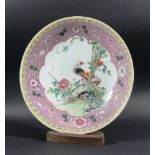 CHINESE CANTON STYLE FAMILLE ROSE CHARGER, 20th century, painted with a peacock and flowers inside a