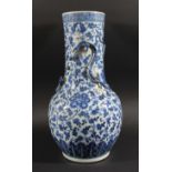 CHINESE BLUE AND WHITE BALUSTER VASE, 19th century, decorated with scrolling foliage and applied