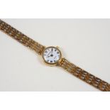 A LADY'S 9CT. GOLD WRISTWATCH BY MAPPIN & WEBB the signed circular white dial with Roman numerals,