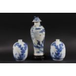 CHINESE BALUSTER VASE AND COVER, blue painted with figures before a lake and pagoda, height 26cm;