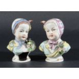 PAIR OF HOCHST STYLE BUSTS, in the 18th century manner, each of a girl with a posy of flowers and
