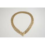 A 9CT. GOLD PLAITED LINK NECKLACE with v-shaped clasp, 43cm. long, 18 grams.