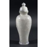 CHINESE PALE GREY JADE VASE AND COVER, of inverted baluster form, carved with a warrior and a