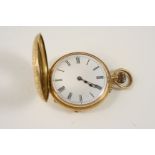 AN 18CT. GOLD HALF HUNTING CASED POCKET WATCH the white enamel dial with Roman numerals, the front