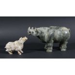 CHINESE CARVED STONE RHINOCEROS, standing four square, length 21cm; together with another smaller in