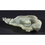 CHINESE CELADON JADE BRUSH WASHER, in the form of a toad on a lily leaf with a flower and seed