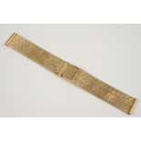 A 9CT. GOLD WRISTWATCH STRAP of granulated brick link design, with ladder clasp with saftely bar,
