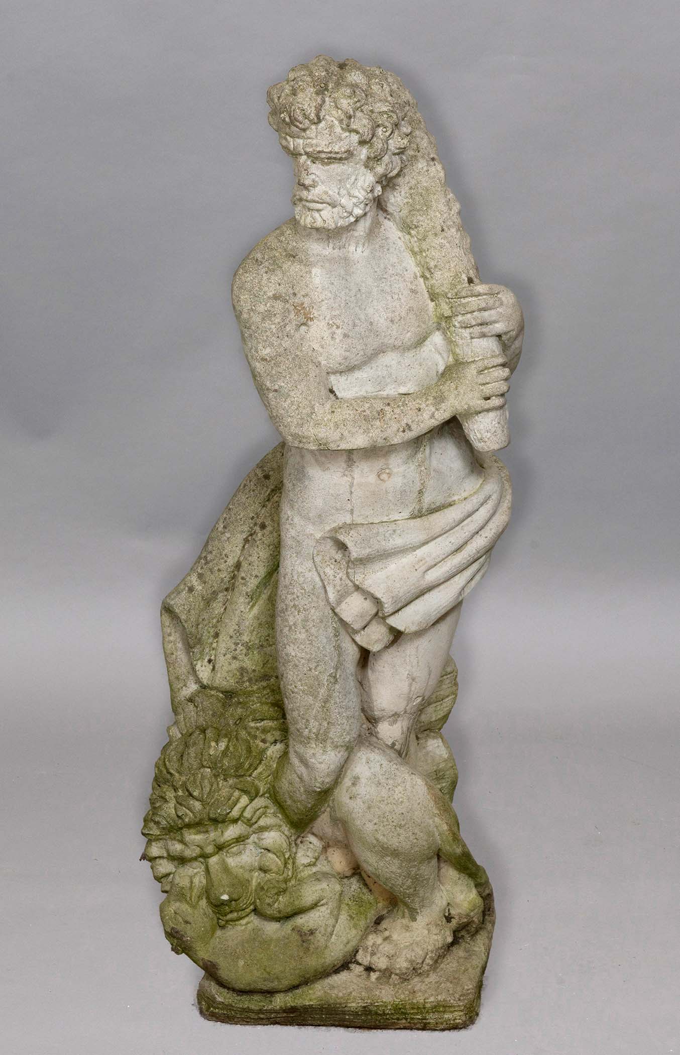 RECONSTITUTED STONE FIGURE OF HERCULES, standing holding a club, a lion at his feet, height 123cn