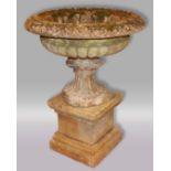 RECONSTITUTED STONE URN ON PEDESTAL, with egg and dart rim, stop fluted body, scalloped foot and