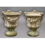 PAIR OF RECONSTITUTED STONE URNS, of campana form cast in high relief with knotted swags above
