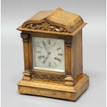 FRENCH WALNUT 19TH CENTURY MANTEL CLOCK, the silvered dial with 5 1/4" chapter ring, on a brass