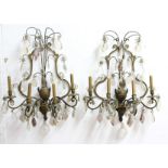 PAIR OF FRENCH FOUR LIGHT GILT BRASS AND CUT GLASS WALL LIGHTS, the branches from a central urn,