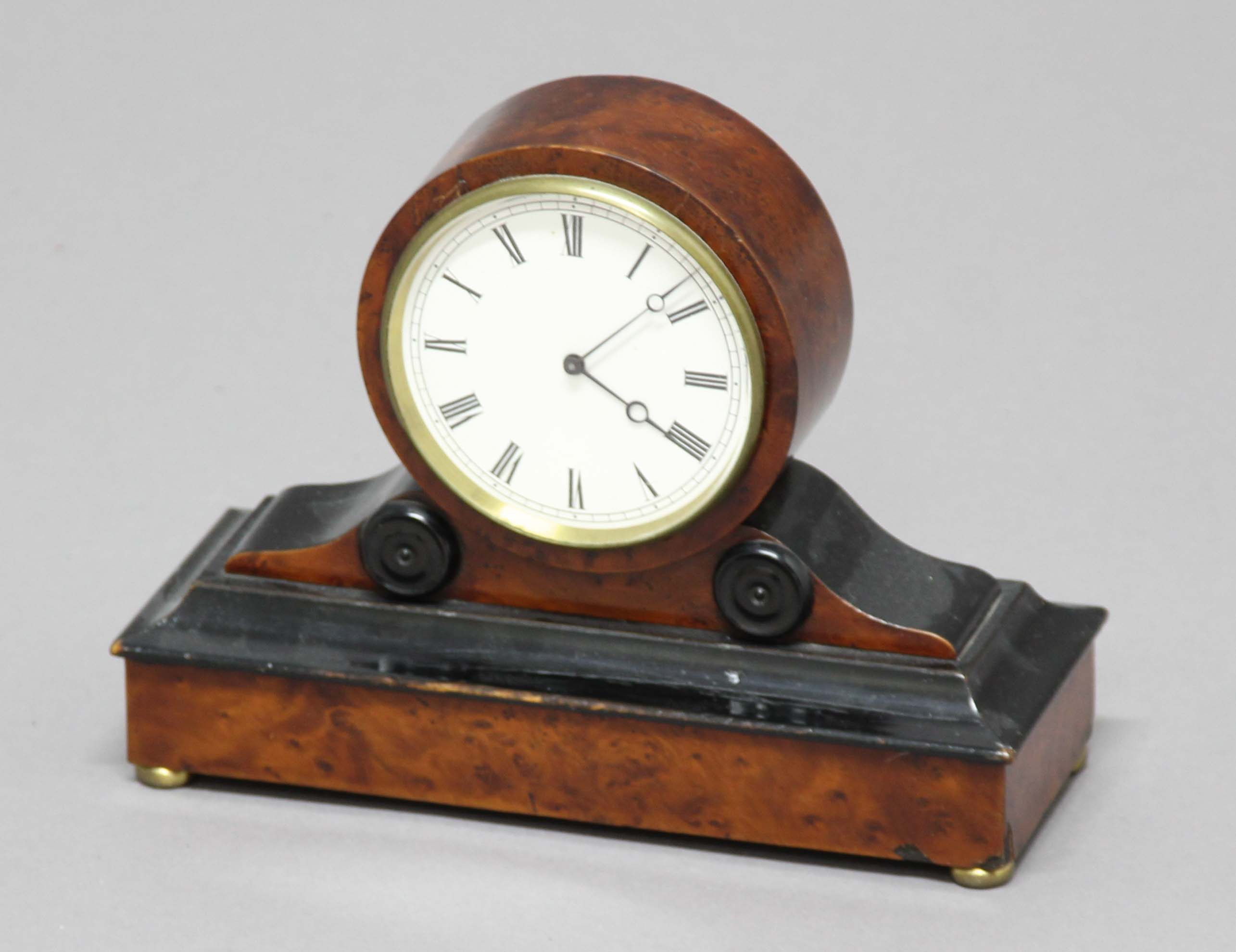 19TH CENTURY BURR MAPLE AND EBONISED MANTEL CLOCK, with a 3 1/2" enamelled dial on a brass Brevete