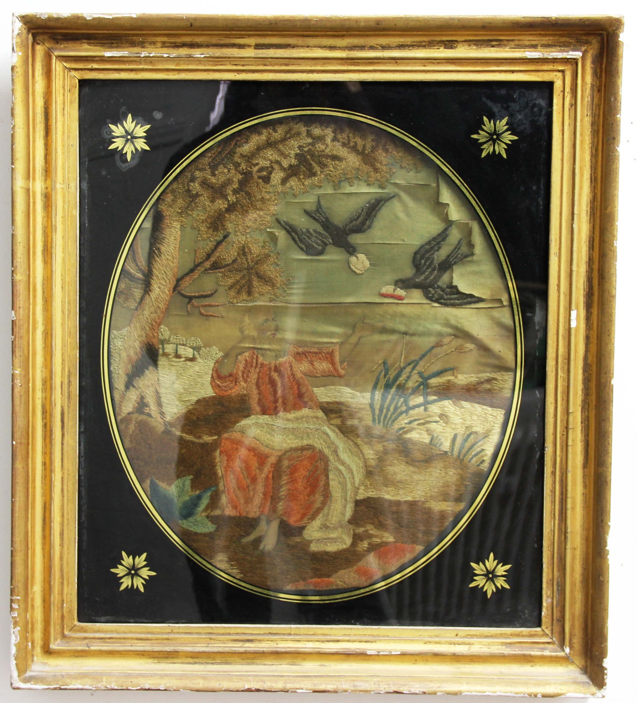 SILKWORK PICTURE OF ST FRANCIS, circa 1800, he seated beneath a tree feeding birds, 40cm x 34cm