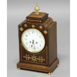 REGENCY STYLE MAHOGANY AND BRASS MOUNTED MANTEL CLOCK, the 5 1/2" enamelled dial with arabic