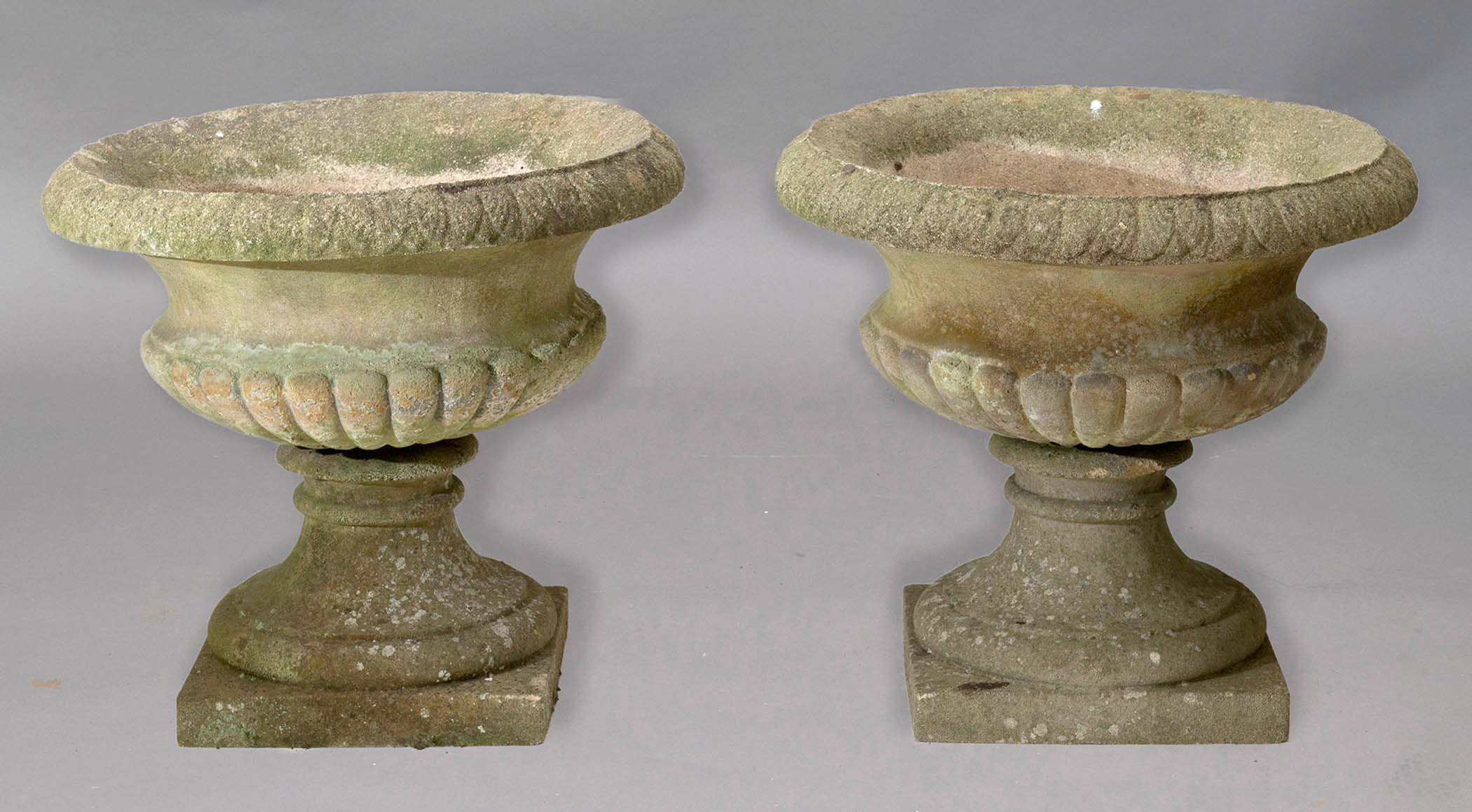 PAIR OF RECONSTITUTED STONE SHALLOW URNS, stop fluted decoration on socle bases, diameter 54cm (2)