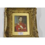 A FRAMED 19thC OFFICERS PORTRAIT. An early 19thC officers portrait in red dress uniform with,